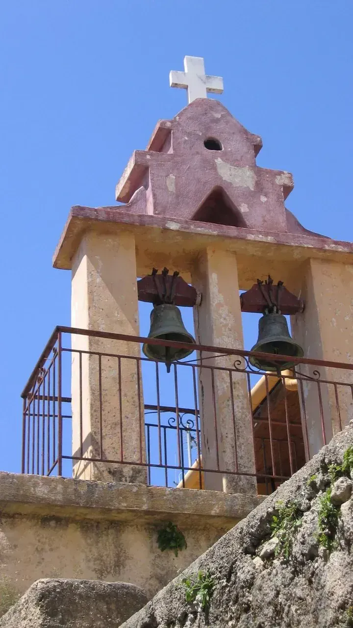 Pink church bell tower with twin bells - Corfu - Greece